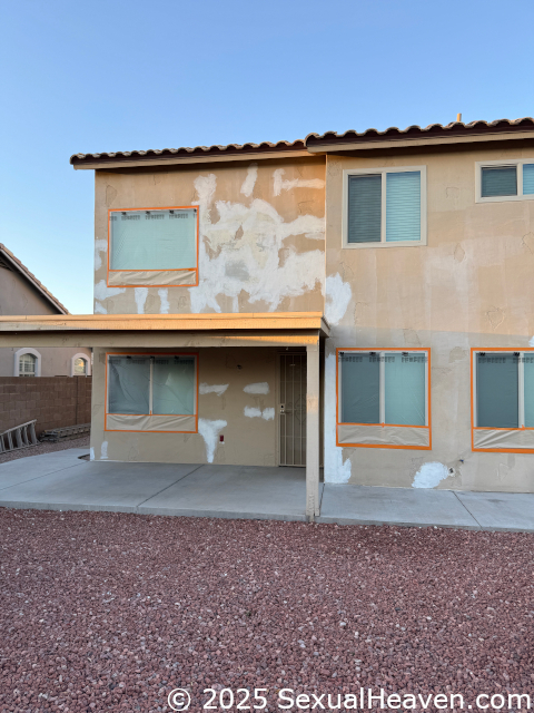 The back of the house with extensive repairs.