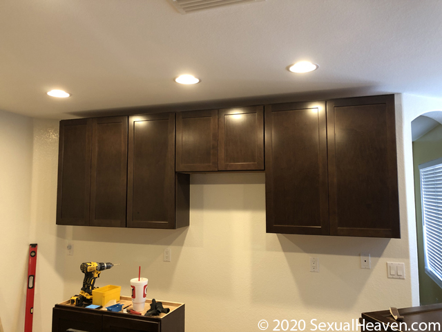 3 wall cabinets affixed to the wall.
