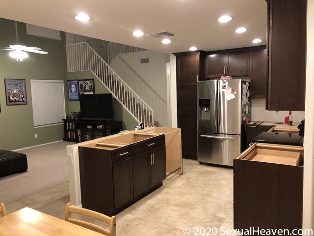 A living room as seen from a kitchen.