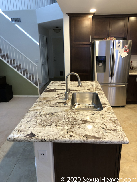 A single tier kitchen island.