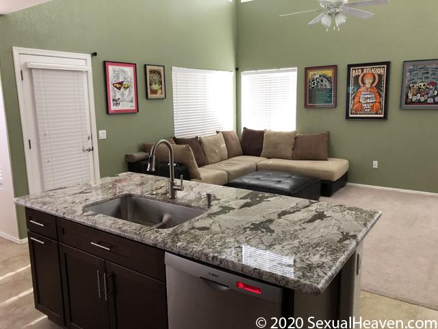 A living room as seen from a kitchen.