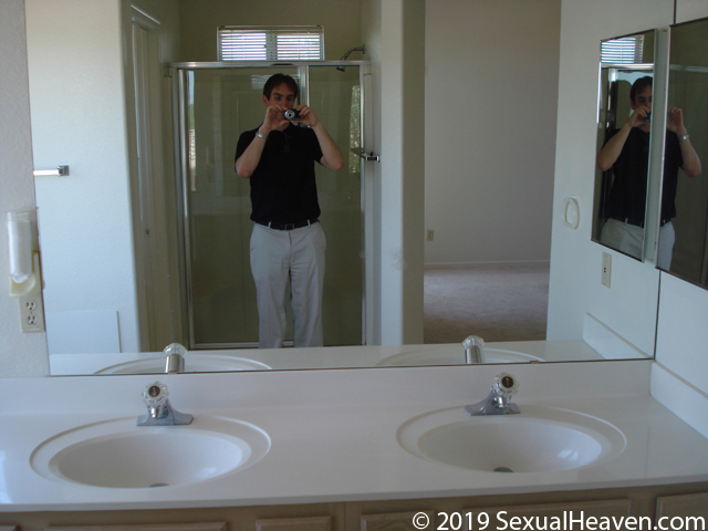 A bathroom vanity and mirror.