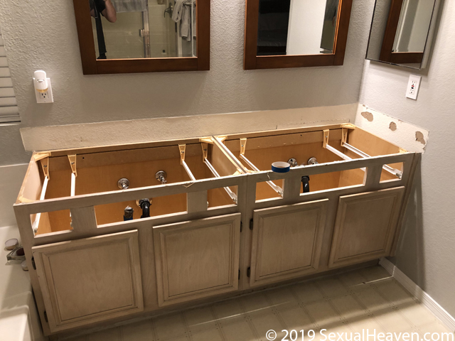 A bathroom vanity without a countertop.