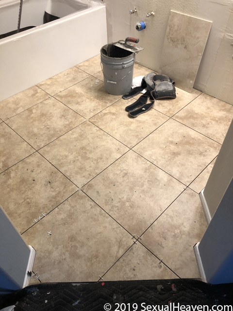 A tiled bathroom floor.