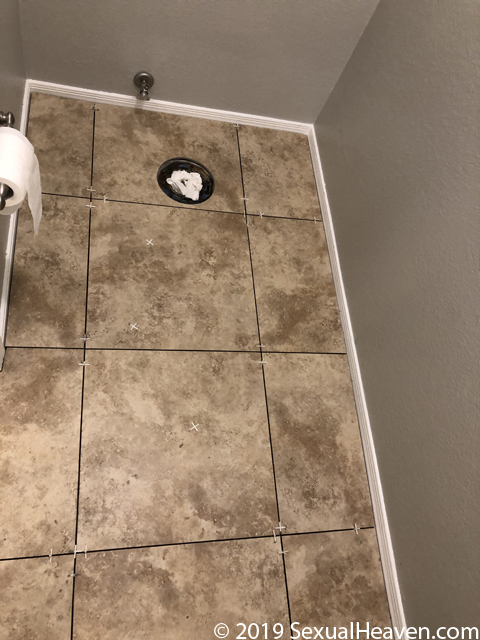 A tiled bathroom floor.