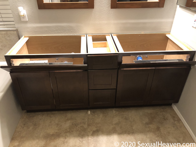 Flip down drawers on a vanity.