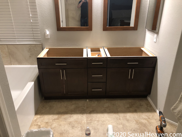 A vanity with handles attached.